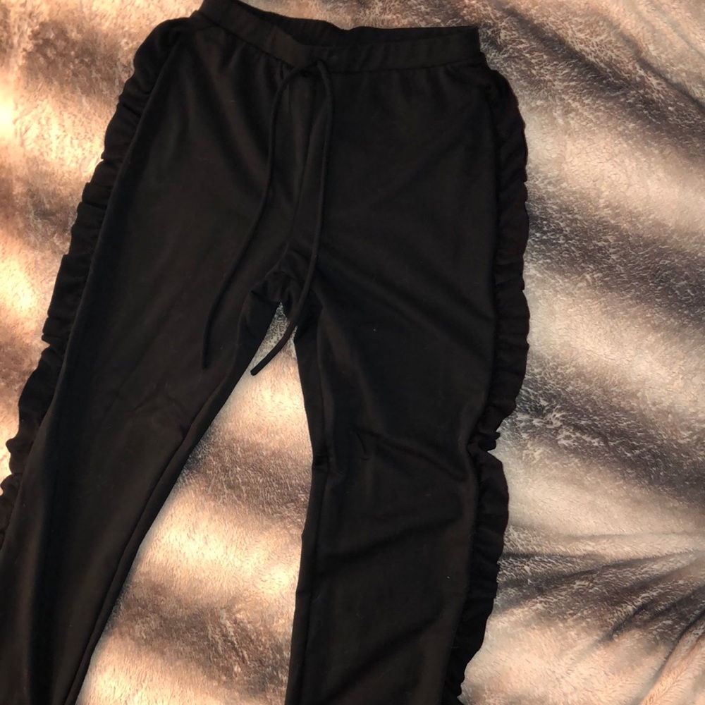 Black ruffled pants
